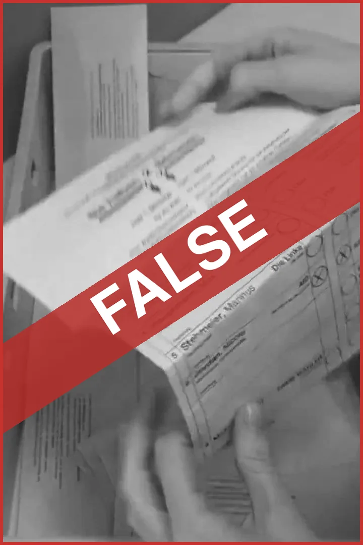 FALSE: hands hold a ballot paper over a crate of postal vote envelopes
